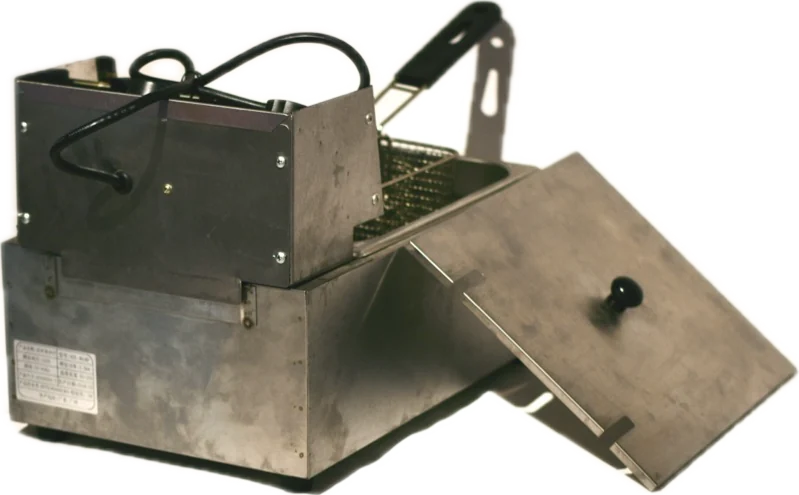 Installation component of Relations: a stainless-steel fryer with its lid open
